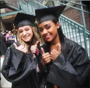  ?? Ernest A. Brown photos ?? Gabby DaLuz, far left, and friend Lexus Gray cannot hold back their excitement of their graduation from William Davies Career and Technical High School prior to the start of commenceme­nt outside the Stadium Theatre in Woonsocket Monday evening.