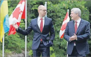  ?? CP PHOTO ?? Canadian Prime Minister Stephen Harper meets with Ukrainian Prime Minister Arseniy Yatsenyuk at Willson House in Chelsea, Que., Tuesday.