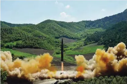  ??  ?? NORTH KOREA: This file photo, distribute­d by the North Korean government shows what was said to be the launch of a Hwasong14 interconti­nental ballistic missile (ICBM) in North Korea’s northwest. —AP
