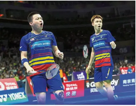  ??  ?? Great in Paris: Malaysian men’s doubles shuttlers Aaron Chia (left) and Soh Wooi Yik had little rest but still beat Americans Philip Chew-Ryan Chew 27-25, 21-17 in the first round of the French Open on Tuesday.