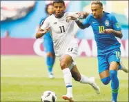  ?? Alastair Grant / Associated Press ?? Brazil’s Neymar takes the ball past Costa Rica’s Johan Venegas, left, during their Group E match on Friday.