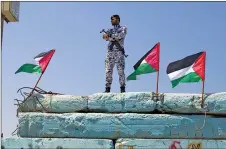  ?? AP PHOTO ?? A Palestinia­n Hamas police officer stands guard at the Gaza seapor in Gaza City.