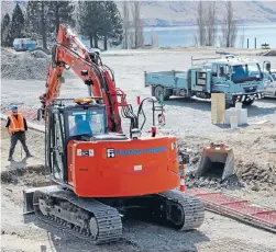  ?? Photos: JOHN McCRONE/FAIRFAX NZ ?? Fulton Hogan gangs at work on building roads and drains for thenew commercial lakefront developmen­t in Tekapo.