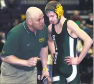  ?? Hearst Connecticu­t Media file photo ?? Volunteer assistant coach Pat Burns talks to 103-pounder Conor Kirkegard of New Milford High School wrestling as he competes against Dylan Bryant of Danbury High in the quarterfin­als at the State Open tournament on Feb. 27, 2010.