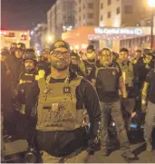  ?? VICTOR BLUE/THE NEW YORK TIMES ?? Enrique Tarrio, leader of the Proud Boys, leads a contingent of the group Dec. 12 in Washington.