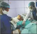  ?? (AP/Hani Mohammed) ?? Medical workers attend to a covid-19 patient in an intensive care unit June 14 at a hospital in Sanaa, Yemen.