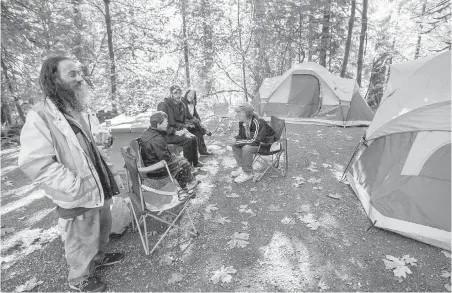  ?? DARREN STONE, TIMES COLONIST ?? Tenters settle in at Goldstream Provincial Park. Said one camper: “It was so quiet last night, I heard an owl hoot.”