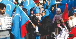  ?? (Murad Sezer/Reuters) ?? UIGHURS TAKE PART in a protest against China at the courtyard of Fatih Mosque in Istanbul in December.