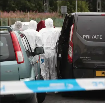  ??  ?? Police remove the human remains from the address at Schaw Road