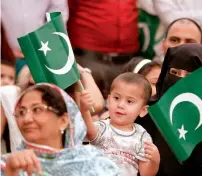  ??  ?? People of all ages gathered at the Pakistani consulate, holding national flags, to celebrate the spirit of Independen­ce Day.