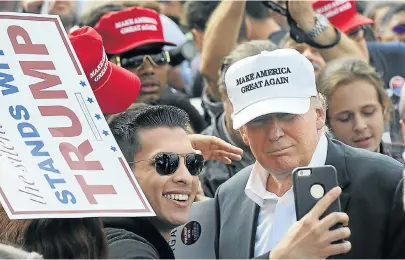  ?? Picture: GETTY IMAGES ?? ASTOUNDING­LY IGNORANT: US President Donald Trump wears a cap that reinforces America’s nationalis­tic perspectiv­es