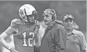  ?? ERIC RUEB/PROVIDENCE JOURNAL ?? Tom Centore, center, is back on the sideline as a volunteer assistant alongside Johnston head coach Joe Acciardo, right.