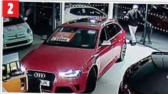  ??  ?? 2 BREAK-IN: His accomplice gains entry to the showroom then opens the car with a hi-tech scanner