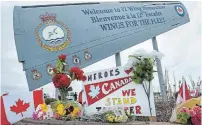  ?? ANDREW VAUGHAN THE CANADIAN PRESS ?? A memorial at 12 Wing Shearwater in Dartmouth, N.S., pays respect to the victims of the military helicopter crash.