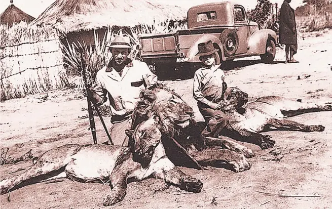  ?? Picture from ‘On Leopard Rock: Adventures From My Life’ by Wilbur Smith ?? ‘With my father after he bravely took on three lions single-handed — a photo I still keep on my writing desk’.