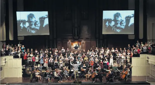  ?? PHOTO: PETER MCINTOSH ?? Worldly music . . . Members of City Choir Dunedin and the Dunedin Symphony Orchestra at a dress rehearsal for The Armed Man: A Mass For Peace, by Karl Jenkins, at the Dunedin Town Hall last night.