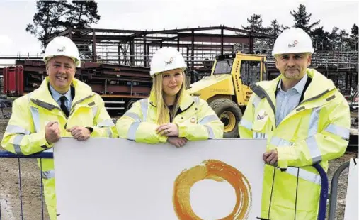  ??  ?? PROGRESS: Keith Brown, left, at Inverurie health centre, with operations manager Rachael Cusden and chief executive Michael Padzinski