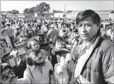  ?? PHOTO ?? In this March 7, 1979 file photo, United Farm Workers President Cesar Chavez talks to striking Salinas Valley farmworker­s during a large rally in Salinas. AP