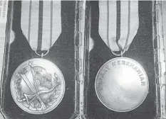  ??  ?? GALLANTRY AWARD: The front and back view of the medal.