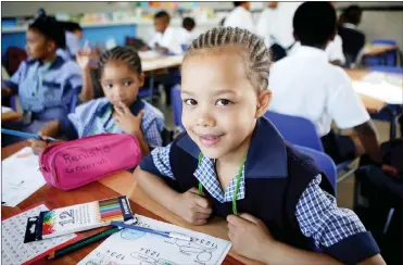  ?? Picture: Brendan Magaar/African News Agency/ANA ?? BRING IT ON! Armed with crayons, Elzhara Jantjies, 6, was determined to have a bright and beautiful first day in Grade 1 at Forest Village Leadership Academy in Blue Downs.