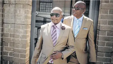  ?? / ALAISTER RUSSELL ?? Businessma­n Kenny Kunene and his friend Sunday Independen­t editor Steve Motale exit the South Gauteng High Court in Johannesbu­rg.