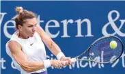  ?? (Getty Images/AFP) ?? Simona Halep of Romania plays a backhand during her match against Magda Linette of Poland at the Western & Southern Open at Lindner Family Tennis Center in Mason.