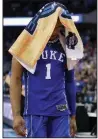  ?? AP/NATI HANRIK ?? Duke’s Trevon Duval walks off the court with a towel over his head after the Blue Devils lost 85-81 in overtime to Kansas in the Midwest Regional Final in Omaha, Neb., on Sunday.