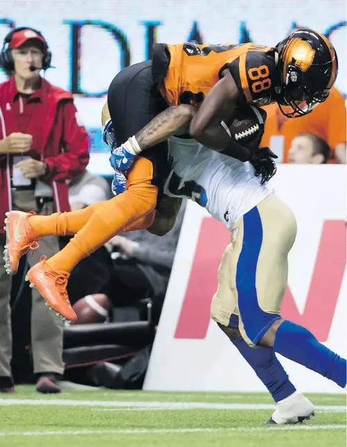  ?? — THE CANADIAN PRESS FILES ?? Lions receiver Shaq Johnson is caught and tackled by Winnipeg defender Brian Walker during Friday’ nights preseason game at B.C. Place, a game B.C. won despite taking 14 penalties.