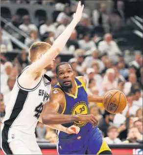  ?? SOOBUM IM / USA TODAY SPORTS ?? Golden State Warriors’ Kevin Durant drives past Davis Bertans of the San Antonio Spurs during the second half of Saturday’s Game 3 of their NBA Western Conference final at AT&T Center in San Antonio, Texas. Durant had 33 points to pace the Warriors to...