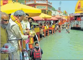  ?? HT PHOTO ?? Chief minister Tirath Singh Rawat (second from left) offers prayers at Har Ki Pauri Ganga ghat in Haridwar on Saturday.