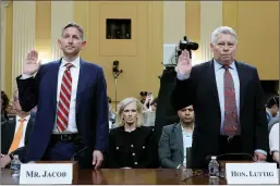  ?? Drew Angerer
/ Getty Images /TNS ?? Greg Jacob, former counsel to Vice President Mike Pence, and J. Michael Luttig, retired judge for the U.S. Court of Appeals for the Fourth Circuit and informal advisor to Mike Pence, are sworn in to testify before the House Select Committee to Investigat­e the January 6th Attack on the U.S. Capitol in the Cannon House Office Building onthursday in Washington, D.C.