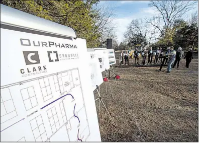  ?? NWA Democrat-Gazette/J.T.WAMPLER ?? Officials including Gov. Asa Hutchinson stand at the future site of the OurPharma pharmaceut­icals manufactur­ing facility Monday in Fayettevil­le.