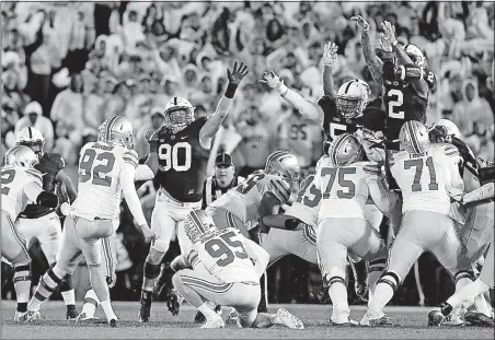  ?? [BARBARA J. PERENIC/DISPATCH] ?? Penn State’s Marcus Allen (2) blocks a field-goal attempt by Tyler Durbin that was returned for the deciding touchdown in the Nittany Lions’ 24-21 win over Ohio State last season.