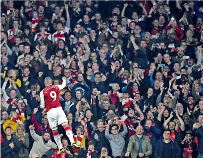  ?? Reuters ?? Arsenal’s Alexandre Lacazette celebrates scoring their first goal against West Bromwich Albion. —