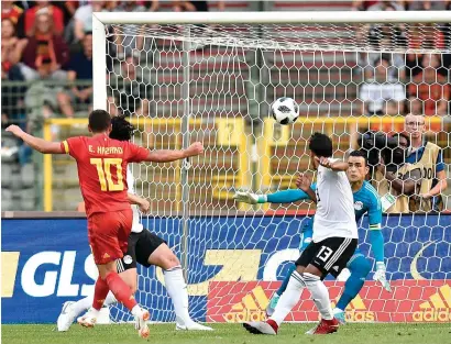  ??  ?? Belgium’s forward Eden Hazard (left) scores a goal during the internatio­nal friendly football match against Egypt at the King Baudouin Stadium, in Brussels, on Wednesday. — AFP