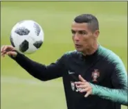  ?? ARMANDO FRANCA — THE ASSOCIATED PRESS ?? Portugal’s Cristiano Ronaldo controls the ball, during a team training session, in Oeiras, outside Lisbon, Monday, June 4 2018.