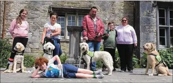  ??  ?? Martin Mullane pictured with leg booth and crutch at Mallow Castle this week with Autism Service Dogs, trainers and handlers.