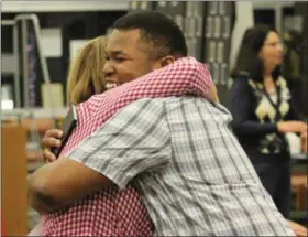  ?? SUBMITTED ?? During this year’s ECITY Welcome Ceremony, Harvey High School alumnus Martin Grice, right, presented to new program members on how the ECITY program and Lubrizol have changed his life.