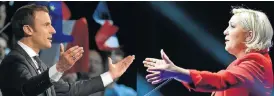  ?? /AFP Photo ?? Tense contest: This combinatio­n of file pictures created on Monday in Paris shows French presidenti­al candidates Emmanuel Macron, left, and Marine Le Pen, who are set for a runoff.