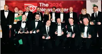  ?? ?? The Impartial Reporter Editor Rodney Edwards (at right edge), pictured with other award winners in London at The 2024 Newspaper Awards, with the ‘Weekly Newspaper of the Year’ award won by this newspaper. Photo: Leo Wilkinson.