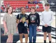  ?? Courtesy photograph ?? Jasmine Daniels with the Little Rock Robinson Lady Senators was presented the Talina McDonald Memorial Hustle Award by Kadense, Madison and Noah McDonald, children of Talina McDonald. The Lady Senators lost to the Horatio Lady Lions 32 to 51 in the first game on Thursday, Dec. 30, the third day of the tournament.