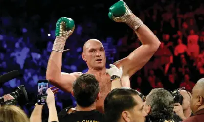  ??  ?? Tyson Fury celebrates winning his fight this year against Deontay Wilder. Photograph: Steve Marcus/Reuters
