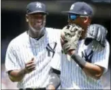  ?? ADAM HUNGER — THE ASSOCIATED PRESS ?? Yankees pitcher Luis Severino, left, laughs with third baseman Miguel Andujar as they walk back to the dugout during the first inning against the Tampa Bay Rays on Saturday in New York.