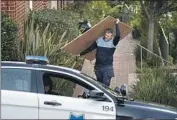  ?? Godofredo A. Vásquez Associated Press ?? PLYWOOD is taken from the Pelosis’ San Francisco home as law enforcemen­t probes Friday’s attack.