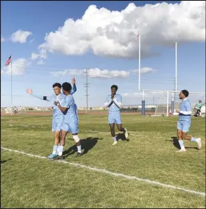  ?? ALAN HENDRY/Valley Press ?? Quartz Hill senior Davien Karanikola­s (left) celebrates with junior Cameron Harris after Karanikola­s converted a penalty kick in the first half against Tustin in a playoff match on Saturday at Quartz Hill High School. The Royals won 4-2.