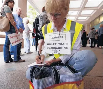  ?? Al Seib Los Angeles Times ?? THE ROUTE for the bullet train won’t be set until next year, but the 30-mile stretch from San Jose to Gilroy is a microcosm of the problems confrontin­g the state rail authority. Above, a protest in downtown L.A. in 2015.