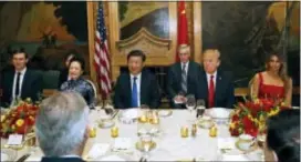  ?? ALEX BRANDON — THE ASSOCIATED PRESS ?? President Donald Trump and Chinese President Xi Jinping, with their wives, first lady Melania Trump and Chinese first lady Peng Liyuan are seated during a dinner at Mar-a-Lago, Thursday in Palm Beach, Fla. White House senior adviser Jared Kushner is...