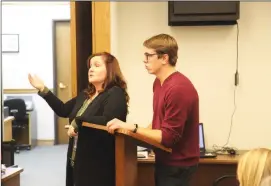  ?? Caleb Lunetta/The Signal ?? Gina Rodriguez, the Newhall School District coordinato­r of Student Support Services, and Jason Busack, a social worker with the district, talk to the school board and administra­tors Wednesday about how they have identified 77 students within the district who are suffering from some form of homelessne­ss.