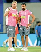  ?? — BCCI ?? Rajasthan Royals mentor Shane Warne talks to leg-spinner Shreyas Gopal.