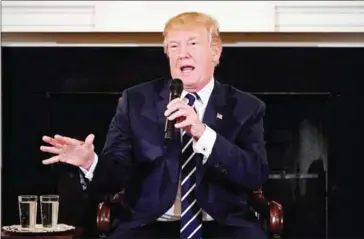  ?? MANDEL NGAN/AFP ?? US President Donald Trump takes part in a ‘listening session’ on gun violence with teachers and students in the State Dining Room of the White House on February 21.